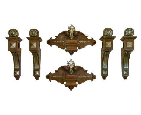 Set of four late Continental gilt metal-mounted walnut curtain pole brackets, circa 1900, each with 6cm aperture, the palmett