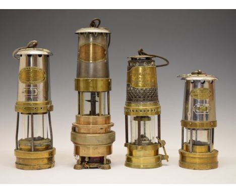 Four vintage miners lamps comprising: Naylor Spiralarm Type 'M', a Best's Gauzeless Lamp, a Thomas & Williams Cambrian Type N