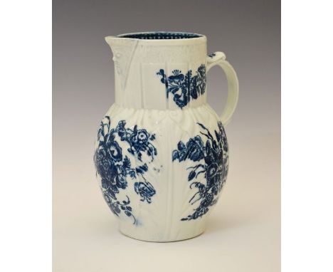 18th Century Caughley leaf moulded jug having blue transfer printed floral decoration, 19.5cm high  Condition: Small rim chip