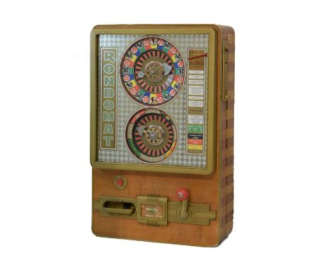 Mid 20th Century German 'Rondomat' roulette slot machine having two multi-coloured dials within mirrored glazed facia beside 