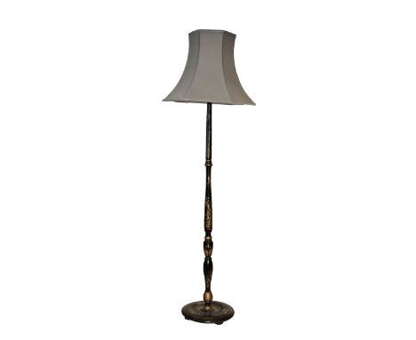 Early 20th Century black lacquered chinoiserie standard lamp, the turned stem and circular base decorated with figures, 145cm