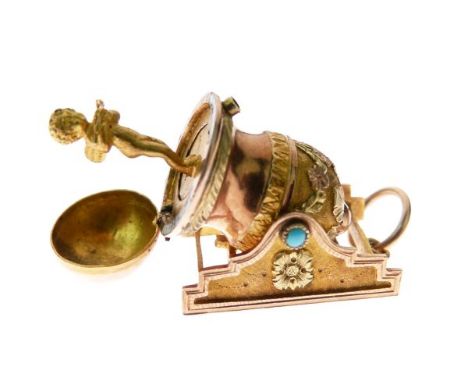 Early 19th Century gold trinket in the form of a cannon, the spring mechanism opening to reveal a figure of Cupid emerging fr