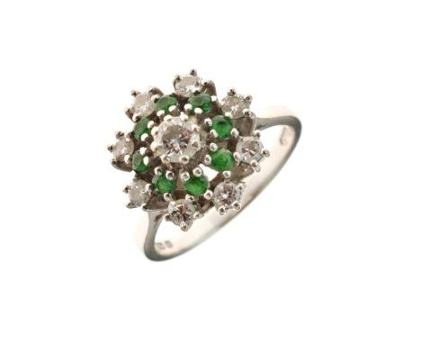 Diamond and emerald 18ct white gold cluster ring, the principal brilliant cut of approximately 0.2 carats, enclosed by eight 