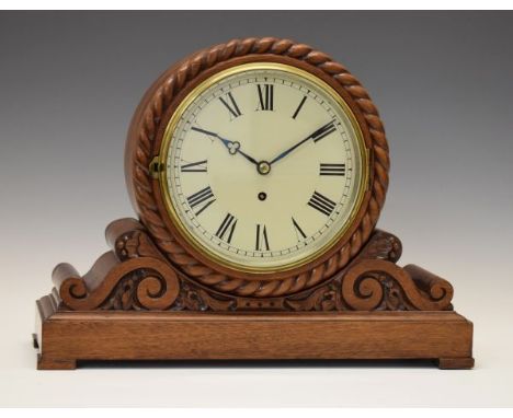 Late 19th Century carved walnut and mahogany mantel clock, the 7.5 white Roman dial with trefoil hour hand, with single-chain