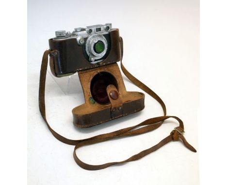 Leica III Serial No.251858 (1937), having a Leitz Elmar f=5cm 1:3,5 lens, in a Leica brown leather case  Condition: Shutter m