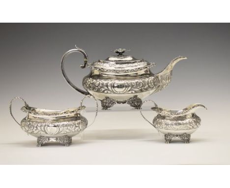 George IV silver three piece tea service, each piece with allover foliate decoration, the teapot with floral knop and reeded 