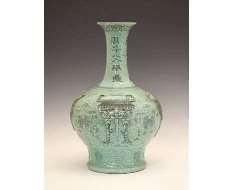 Chinese pale green glazed porcelain bottle shaped vase decorated with archaic vessels, together with symbols of good luck and