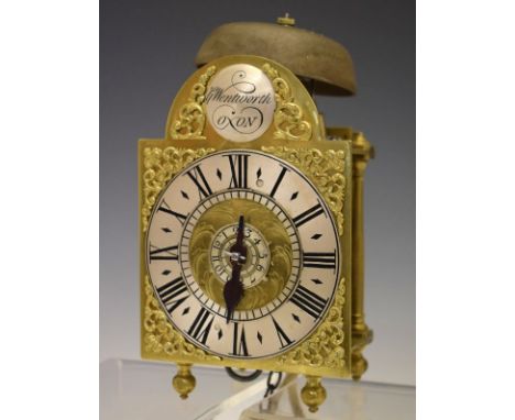 Early 18th Century brass lantern timepiece of small proportions, George Wentworth, Oxon, the 4.25 break arch brass dial havin