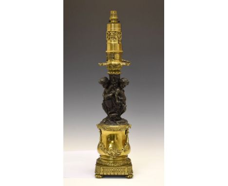 French brass and bronzed spelter figural table lamp, the cylindrical burner collar with plaque GAGNEAU 115 R.LAFAYETTE, over 