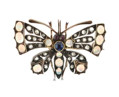 Late Victorian gem set butterfly brooch, circa 1900, opal set trim to the wings and abdomen, a single stone sapphire for the 