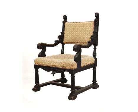 Late 19th Century carved fruitwood hall chair, the padded back and seat between carved uprights with finials modelled as fema