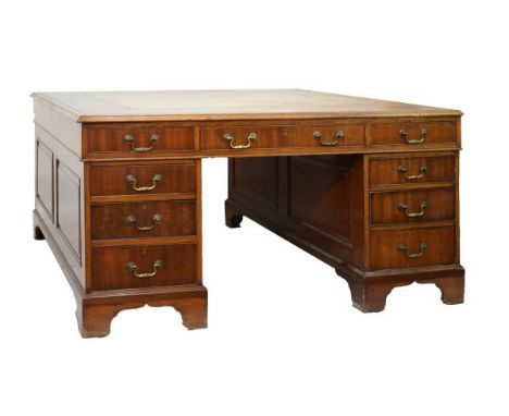 19th Century partner's mahogany desk, the moulded rectangular top with gilt-and blind-tooled tan leather skiver, each long si
