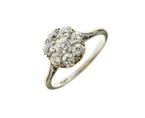 Eight stone diamond cluster ring, the white mount stamped 'Plat', the central brilliant cut of approximately 0.2 carats, the 