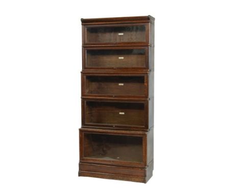 Early 20th Century oak five section modular stacking bookcase by the Globe Wernicke Co Ltd, London, the top section with moul