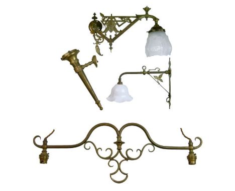 Two late 19th Century brass Aesthetic School wall lights, each having typical stylised foliate decoration. 30.5cm and 46cm lo