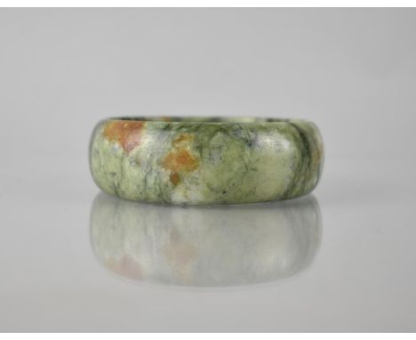 A Large Green Stone Jade Carved Bangle, 25mm Wide and 69mm Internal Dimensions, 102.8gms 