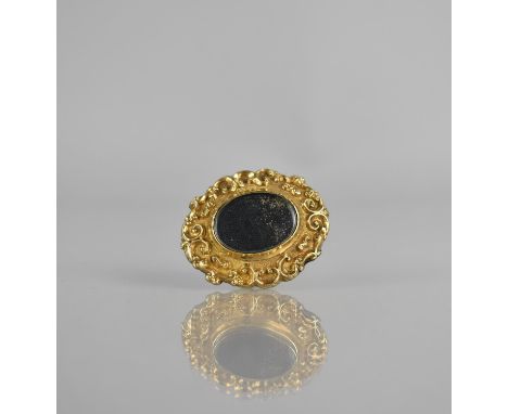 A 19th Century Gold Mounted Mourning Brooch, Central Oval Glass Panel Having Finely Woven Organic Material to Interior, Possi