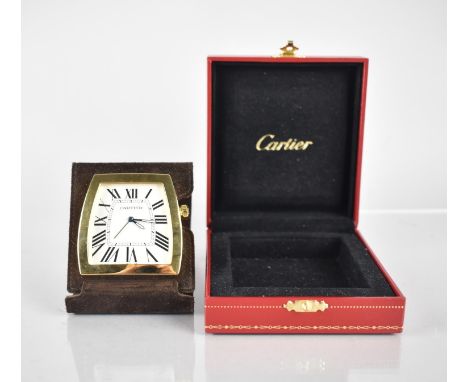 A Cartier La Dona Travel Desk Clock. Shaped White Dial with Roman Numerals, Blue Diamond Shaped Hands with White Enamel Embel