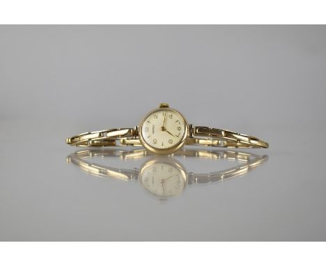 A 9ct Gold Early 20th Century Ladies Wrist Watch by Vertex, Champagne Dial with Gold Coloured Hands, Arabic Numerals and Arro