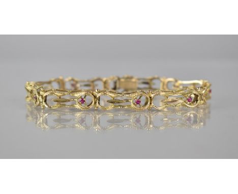 A 14ct Gold and Ruby Nine Panel Wirework Bracelet, Pressed and Textured Figure of Eight Wire Frames, Each with Small Round Cu