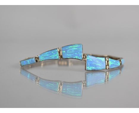 An Opal and Silver Panel Bracelet, 12 Collet Mounted Opal Panels, Largest Measuring 13mm by 10mm Max, 18.75cms Long, Push Cla