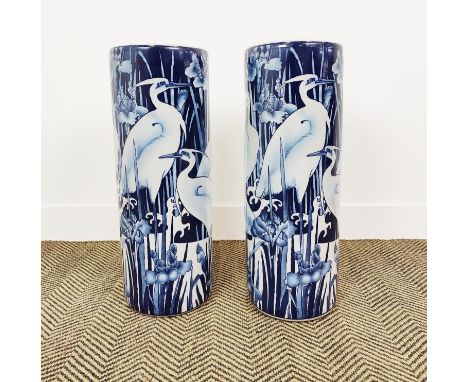 STICK STANDS, a pair, blue and white ceramic with crane decoration, 60cm H x 22cm W. (2) 