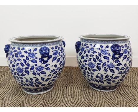 PLANTERS, a pair, blue and white ceramic, 41cm H x 44cm W. (2) 