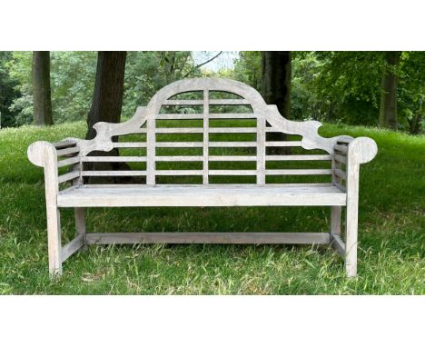 'LUTYENS' STYLE GARDEN BENCH, weathered teak slatted and dowelled construction after the design by Sir Edwin Lutyens, 165cm W