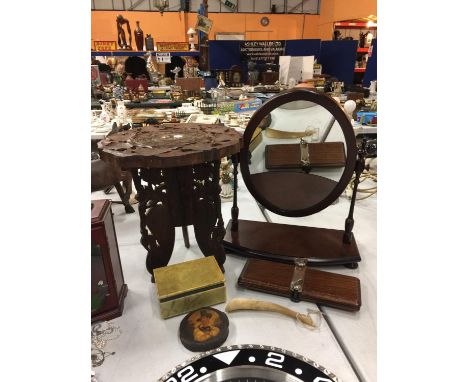 A MAHOGANY SWIVEL DRESSING TABLE MIRROR, A HEAVILY CARVED TRIPOD TABLE WITH INLAY, AN ONYX LIDDED BOX AND A VINTAGE PAPIER MA