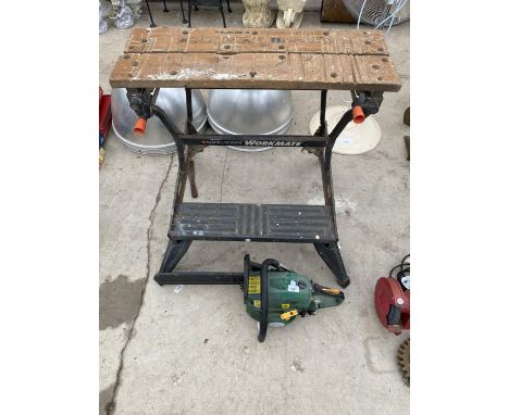 A PETROL CHAINSAW AND A FOLDING WORK BENCH 