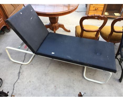 A RECLINING BED/BENCH 