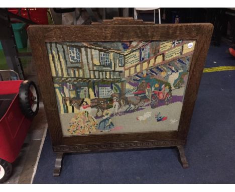 A WOODEN FIRE SCREEN WITH DECORATIVE TAPESTRY VICTORIAN STREET SCENE 
