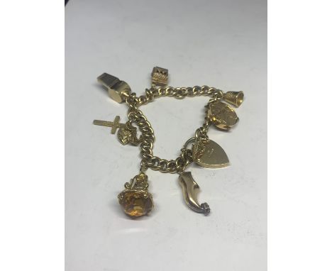 A 9 CARAT GOLD CHARM BRACELET WITH EIGHT CHARMS TO INCLUDE A WHISTLE, BELL, SEAHORSE, TAMBOURINE ETC GROSS WEIGHT 42.5 GRAMS 