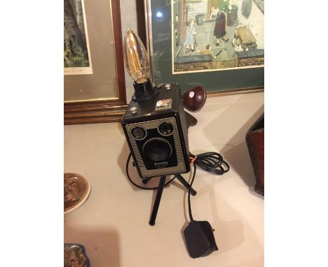 A BOX BROWNIE CAMERA ON TRIPOD STAND CONVERTED TO A LAMP 