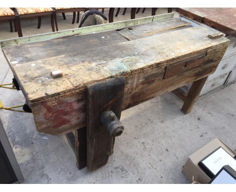 A VINTAGE WOODEN WORK BENCH 