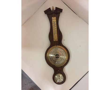 A WOODEN BAROMETER AND THERMOMETER 