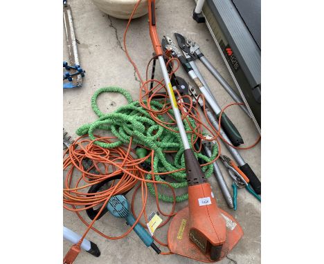 AN ASSORTMENT OF GARDEN ITEMS TO INCLUDE AN ELECTRIC GRASS STRIMMER, HOSE PIPE AND BRANCH LOPPERS ETC 
