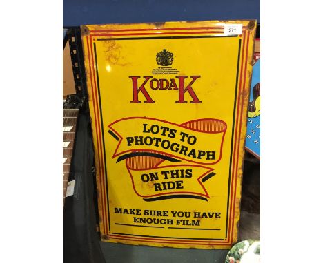 AN ENAMEL KODAK 'LOTS TO PHOTOGRAPH ON THIS RIDE' SIGN 