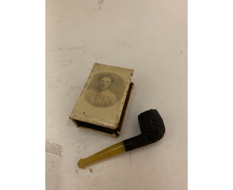 A MATCHBOX COVER 'BLIGHTY 1918' AND A SMALL PIPE 