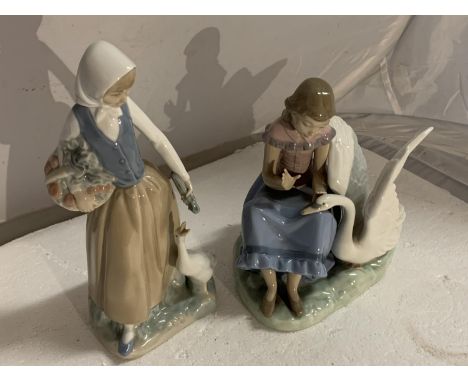 TWO NAO FIGURINES ONE A GIRL WITH A GOOSE AND THE OTHER A GIRL WITH A SWAN 