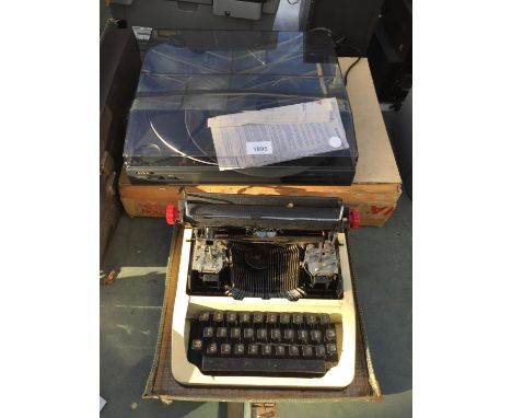 AN AIWA RECORD TURNTABLE AND A RETRO TYPEWRITER 
