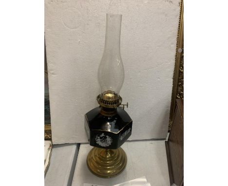 A BRASS AND CERAMIC OIL LAMP 