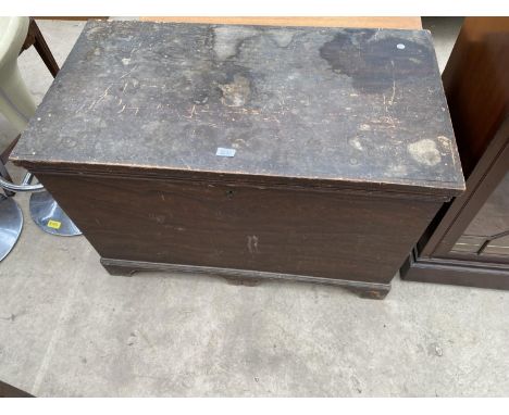 A VICTORIAN PINE BLANKET CHEST WITH INTERIOR CANDLE BOX, TWO DRAWERS AND LINED LID, ON BRACKET FEET HAVING CAST METAL CARRYIN