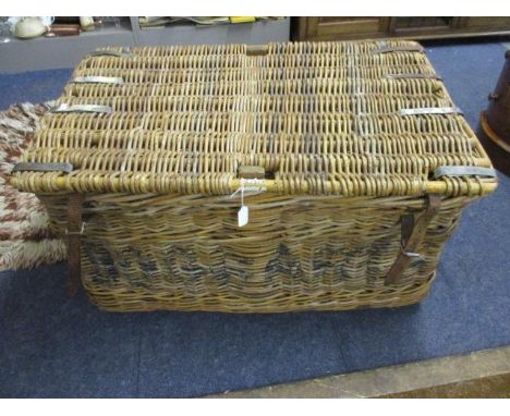 A vintage laundry basket with leather straps and metal supports, 20" x 36" x 21" 