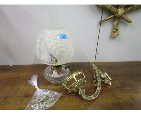 A Duplex Victorian brass and glass oil lamp on a brass wall bracket holder with etched and frosted glass shade 