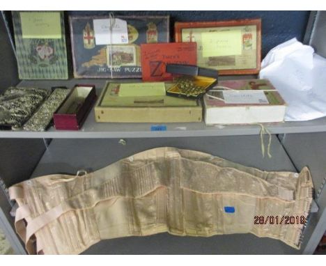 A mixed lot to include coins, an evening clutch bag, a 1950s corset, vintage jigsaws and theatre related ephemera 