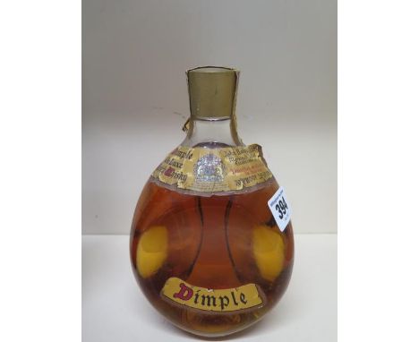 A bottle of John Haig and Co Ltd Dimple de luxe Scotch whiskey - level and seal good 