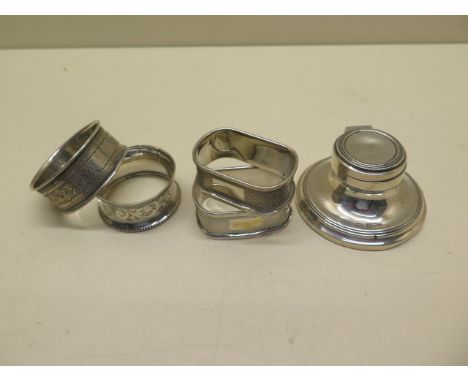 Four silver napkin rings and a small silver inkwell - weighable silver approx 1.5 troy oz - all reasonable condition 