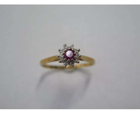 An 18ct yellow gold diamond and ruby type cluster ring size V - approx weight 3.5 grams - in good condition 