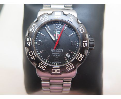 A Tag Heuer Formula 1 quartz gents bracelet wristwatch with black dial - model WAC 1110 serial BT0708XJ4461 with card dated 2